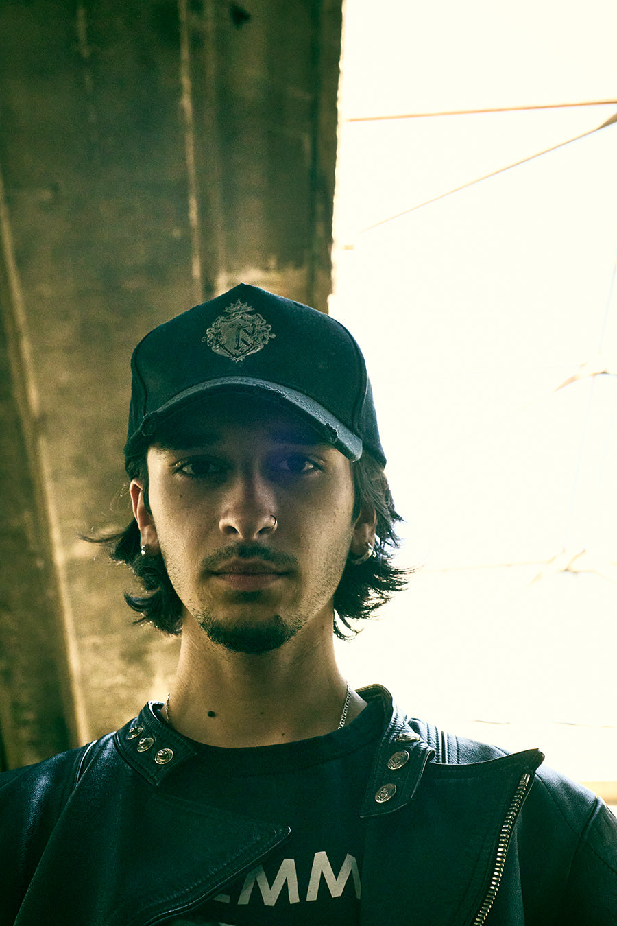 Male wearing the black Trips streetwear cap, showcasing the custom front logo and raw urban aesthetic.